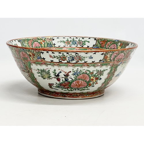 13 - A Chinese Export Rose Medallion punch bowl. Late Qing Dynasty. Emperor Guangxu. Decorated with Guang... 