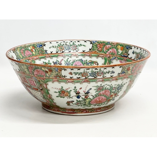 13 - A Chinese Export Rose Medallion punch bowl. Late Qing Dynasty. Emperor Guangxu. Decorated with Guang... 