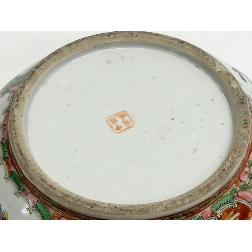 13 - A Chinese Export Rose Medallion punch bowl. Late Qing Dynasty. Emperor Guangxu. Decorated with Guang... 