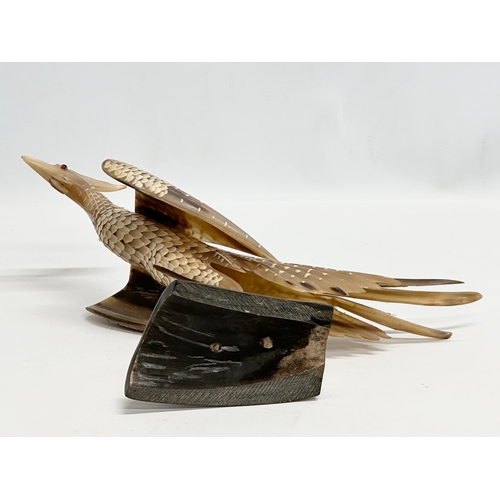 95 - A large Mid 20th Century carved horn bird on stand. 36x30cm