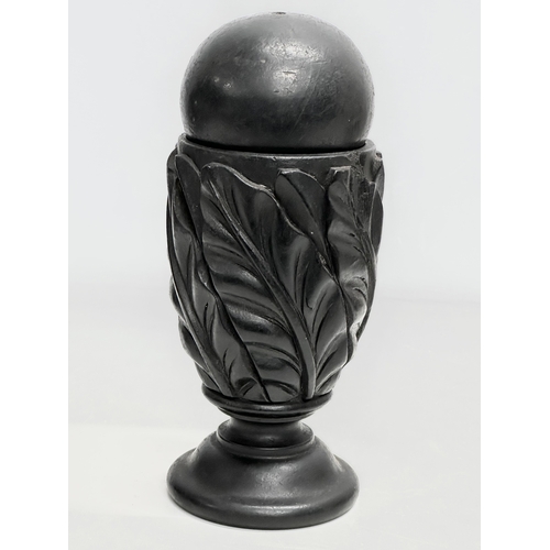 61 - A pair of 19th Century carved ebony garnitures with removable balls and carved Acranthus leaf decora... 