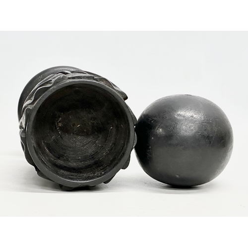 61 - A pair of 19th Century carved ebony garnitures with removable balls and carved Acranthus leaf decora... 