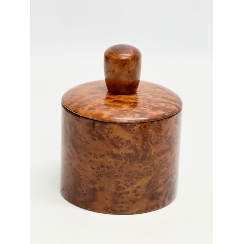 116 - An Early 20th Century burr elm treen ware tobacco jar. 10x14cm.