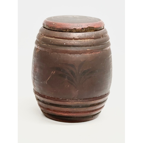 16 - Riga Ware. A 17th/18th Century turned wooden tobacco barrel jar. 11x15cm.