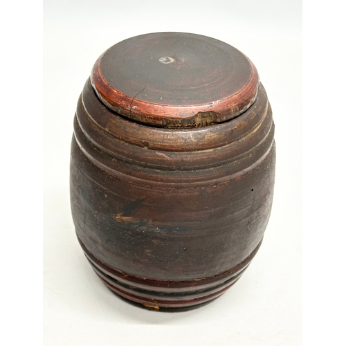 16 - Riga Ware. A 17th/18th Century turned wooden tobacco barrel jar. 11x15cm.