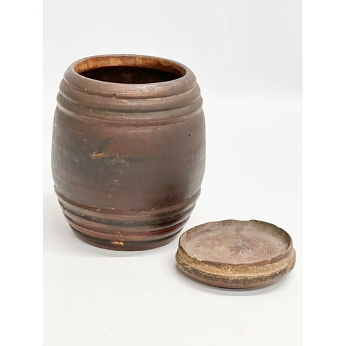 16 - Riga Ware. A 17th/18th Century turned wooden tobacco barrel jar. 11x15cm.