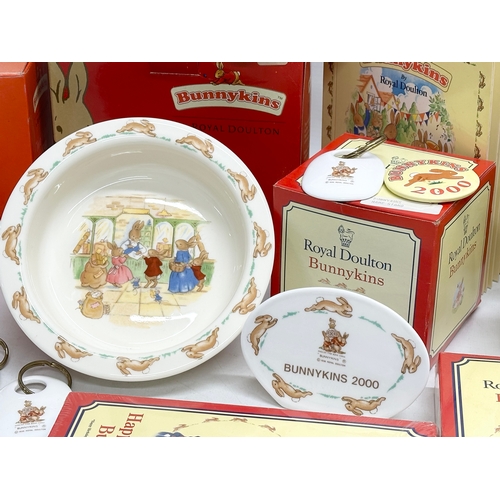 906 - A collection of Royal Doulton Bunnykins. Plates, clocks, money banks, key rings, cups etc