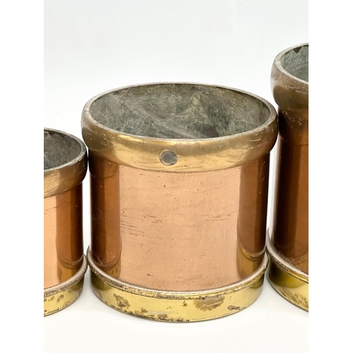 53 - A set of 6 Late 19th Century copper and brass measures. 14.5x14cm. 11.5x11cm. 9x9cm.