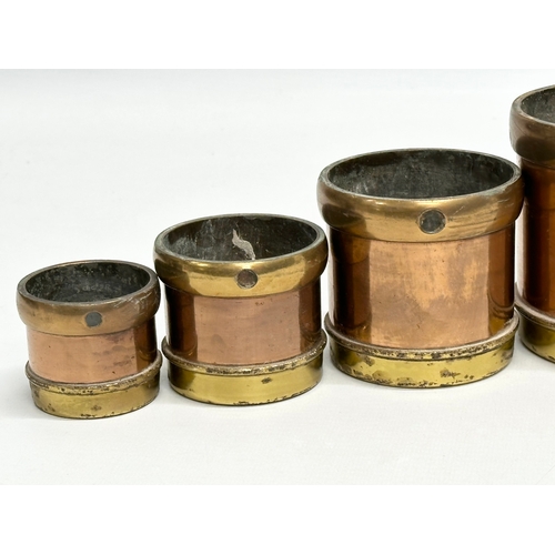 53 - A set of 6 Late 19th Century copper and brass measures. 14.5x14cm. 11.5x11cm. 9x9cm.