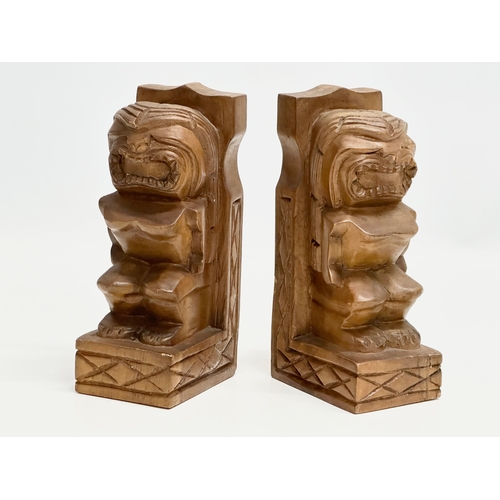 536 - A pair of Mid 20th Century Tiki Monkeypod bookends. 19.5cm.