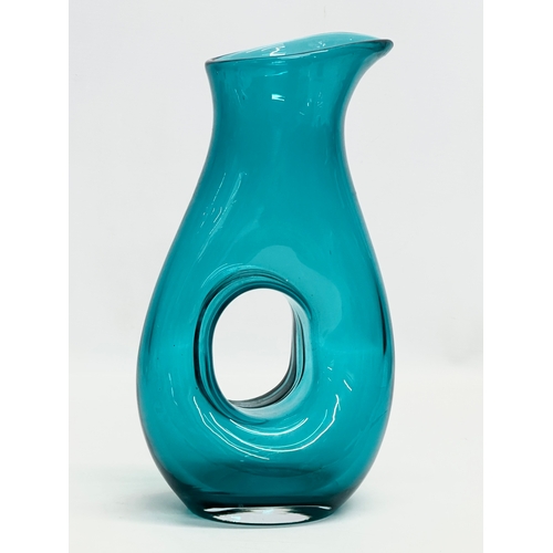 97 - A Mid Century aqua glass carafe style vase. In the manner of Fulvio Bianconi. 16x29cm