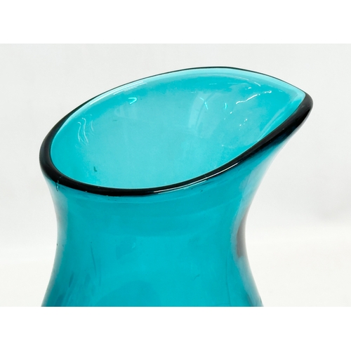 97 - A Mid Century aqua glass carafe style vase. In the manner of Fulvio Bianconi. 16x29cm