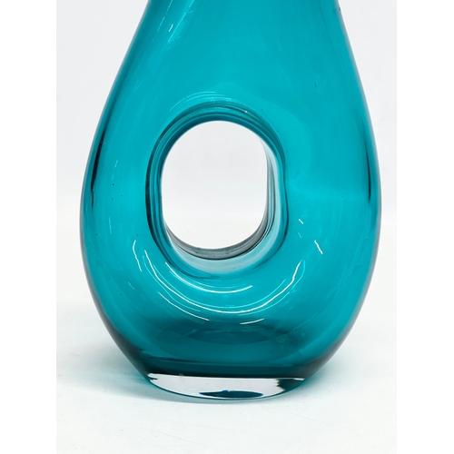 97 - A Mid Century aqua glass carafe style vase. In the manner of Fulvio Bianconi. 16x29cm