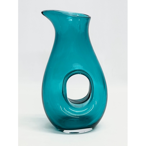 97 - A Mid Century aqua glass carafe style vase. In the manner of Fulvio Bianconi. 16x29cm