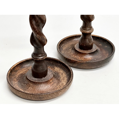 149 - A pair of tall Early 20th Century oak barley twist candlesticks. Circa 1900-1920. 32cm