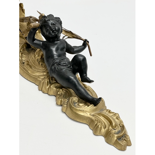 44 - A good quality bronze and brass, rococo style and cherub wall light. 43x28cm