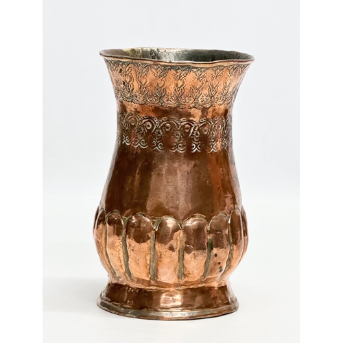 129 - A Late 19th Century Middle Eastern engraved copper vase. 10.5x16cm.