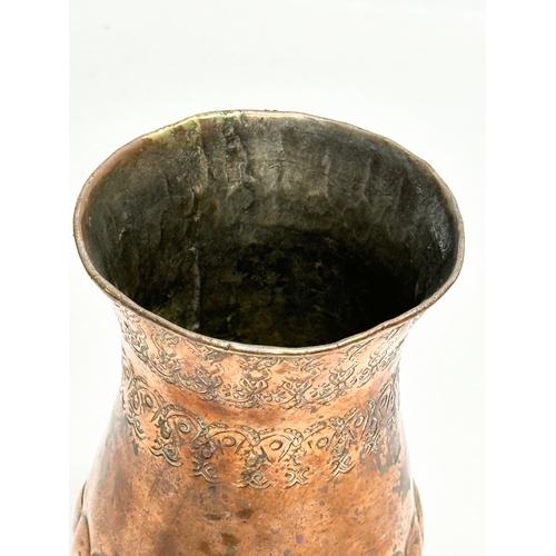 129 - A Late 19th Century Middle Eastern engraved copper vase. 10.5x16cm.