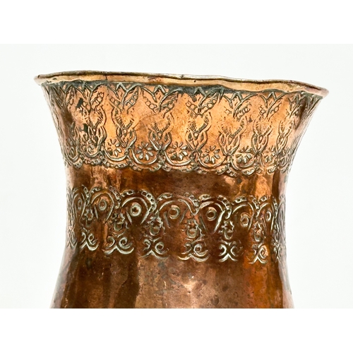 129 - A Late 19th Century Middle Eastern engraved copper vase. 10.5x16cm.