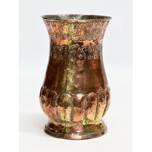 129 - A Late 19th Century Middle Eastern engraved copper vase. 10.5x16cm.