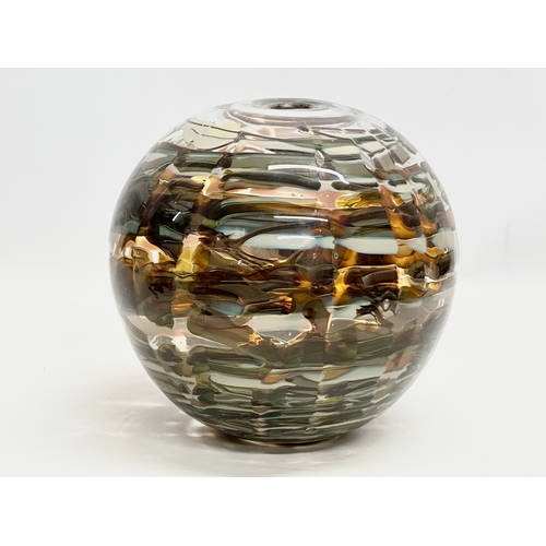 556 - A large Late 20th Century multi coloured art glass bulbous vase. 24x24cm.