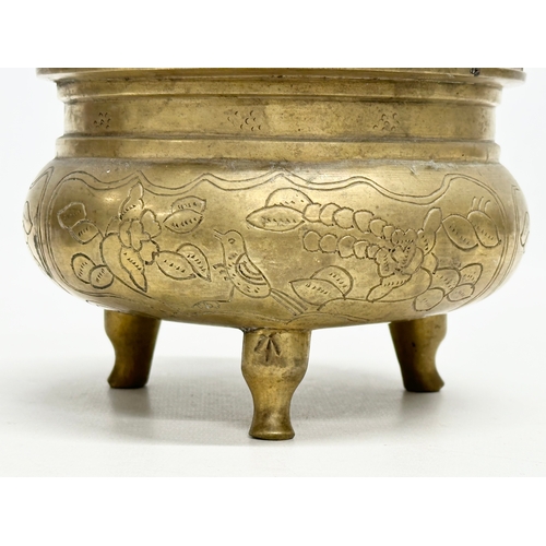 77 - A 19th Century Chinese engraved brass tripod censor/incense burner. Emperor Xuande mark. 15x15x13cm.