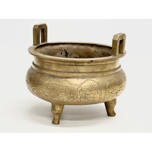 77 - A 19th Century Chinese engraved brass tripod censor/incense burner. Emperor Xuande mark. 15x15x13cm.