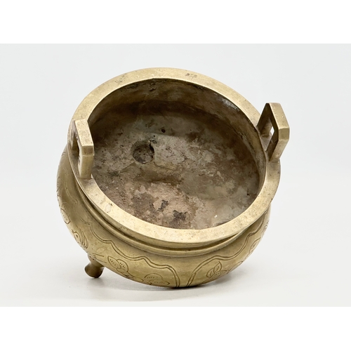 77 - A 19th Century Chinese engraved brass tripod censor/incense burner. Emperor Xuande mark. 15x15x13cm.