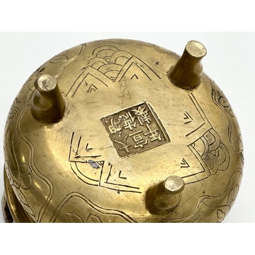 77 - A 19th Century Chinese engraved brass tripod censor/incense burner. Emperor Xuande mark. 15x15x13cm.