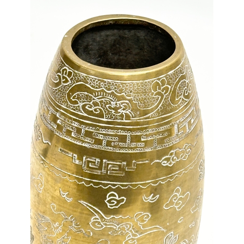 198 - An Early 20th Century Chinese engraved brass vase. Emperor Xuande mark. 20cm