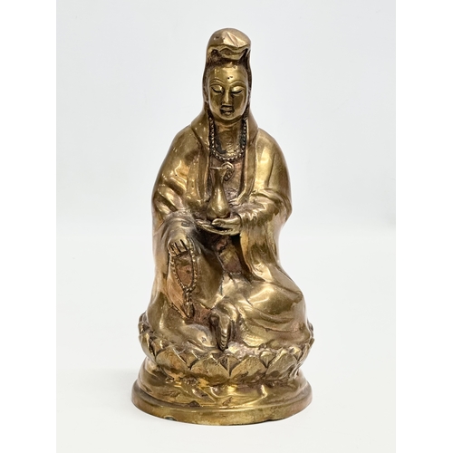 78 - A 19th Century bronze Kwan Yin statue. 21cm.