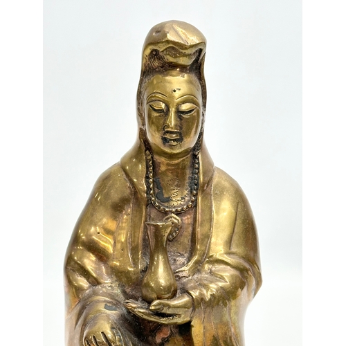 78 - A 19th Century bronze Kwan Yin statue. 21cm.