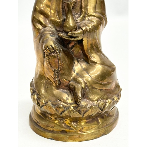 78 - A 19th Century bronze Kwan Yin statue. 21cm.