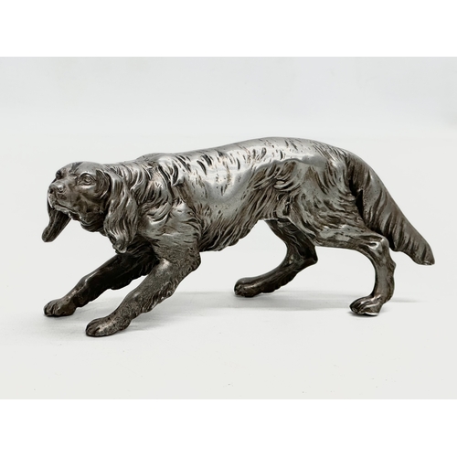 205 - An Early 20th Century heavy chrome Irish Setter sculpture. 19cm