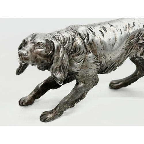 205 - An Early 20th Century heavy chrome Irish Setter sculpture. 19cm