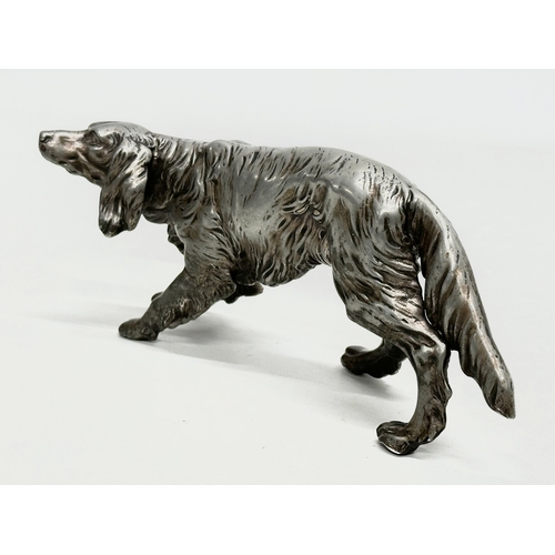 205 - An Early 20th Century heavy chrome Irish Setter sculpture. 19cm