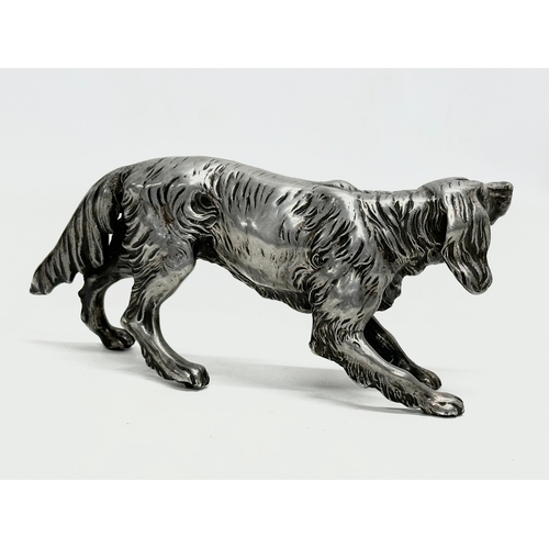 205 - An Early 20th Century heavy chrome Irish Setter sculpture. 19cm