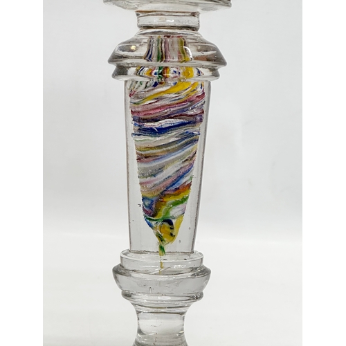 31 - A Late 19th/Early 20th Century glass oil lamp. With multi coloured art glass column. 39cm