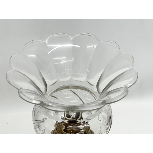 31 - A Late 19th/Early 20th Century glass oil lamp. With multi coloured art glass column. 39cm