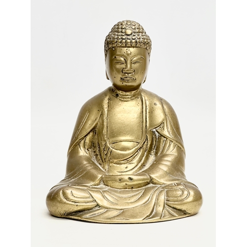 577 - An Early/Mid 20th Century brass Shakyamuni Buddha statue. 12x10x15.5cm.