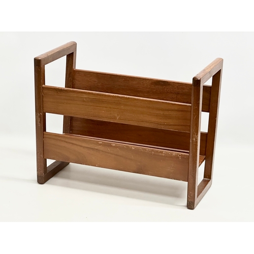 651 - A Mid Century teak magazine rack. By Fyne Ladye.  (4)