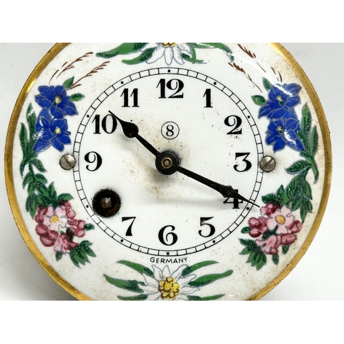 208 - A Mid 20th Century miniature German enamel face wall clock. With original box, key and pendulum. 7cm