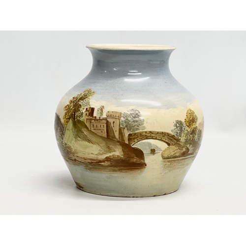 698 - An Early 20th Century hand painted pottery vase. Circa 1900-1920. 18x18cm.