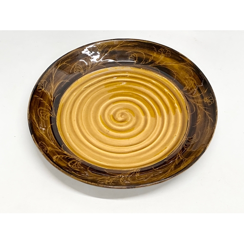 699 - Two large Mid Century glazed stoneware centrepiece bowls. Marked Grubb. 1975. 43x7cm. 40x5cm.