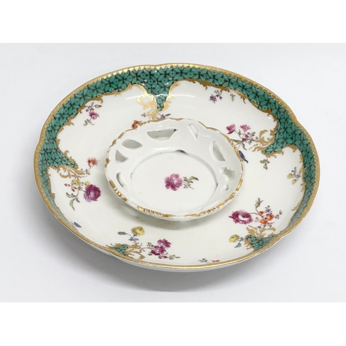 18 - A 19th Century Meissen porcelain cup and saucer.