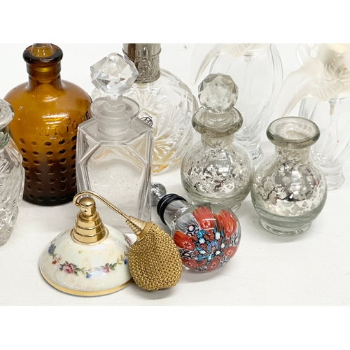 560 - A collection of vintage perfumes bottles etc.