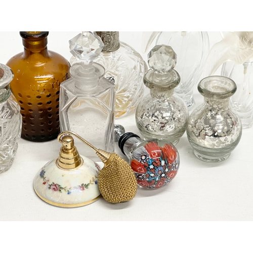 560 - A collection of vintage perfumes bottles etc.