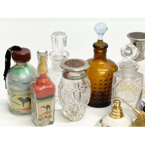 560 - A collection of vintage perfumes bottles etc.