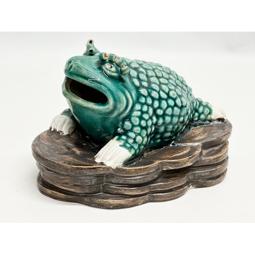 75 - A Chinese Shiwan glazed stoneware frog on stand. 2 impressed marks. 22x15x15cm.