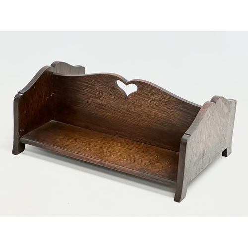 659 - An Early 20th Century oak book trough. 39x28x17cm.